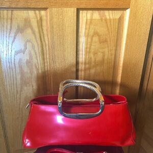Elegant Red Handbag with Gold Accents
